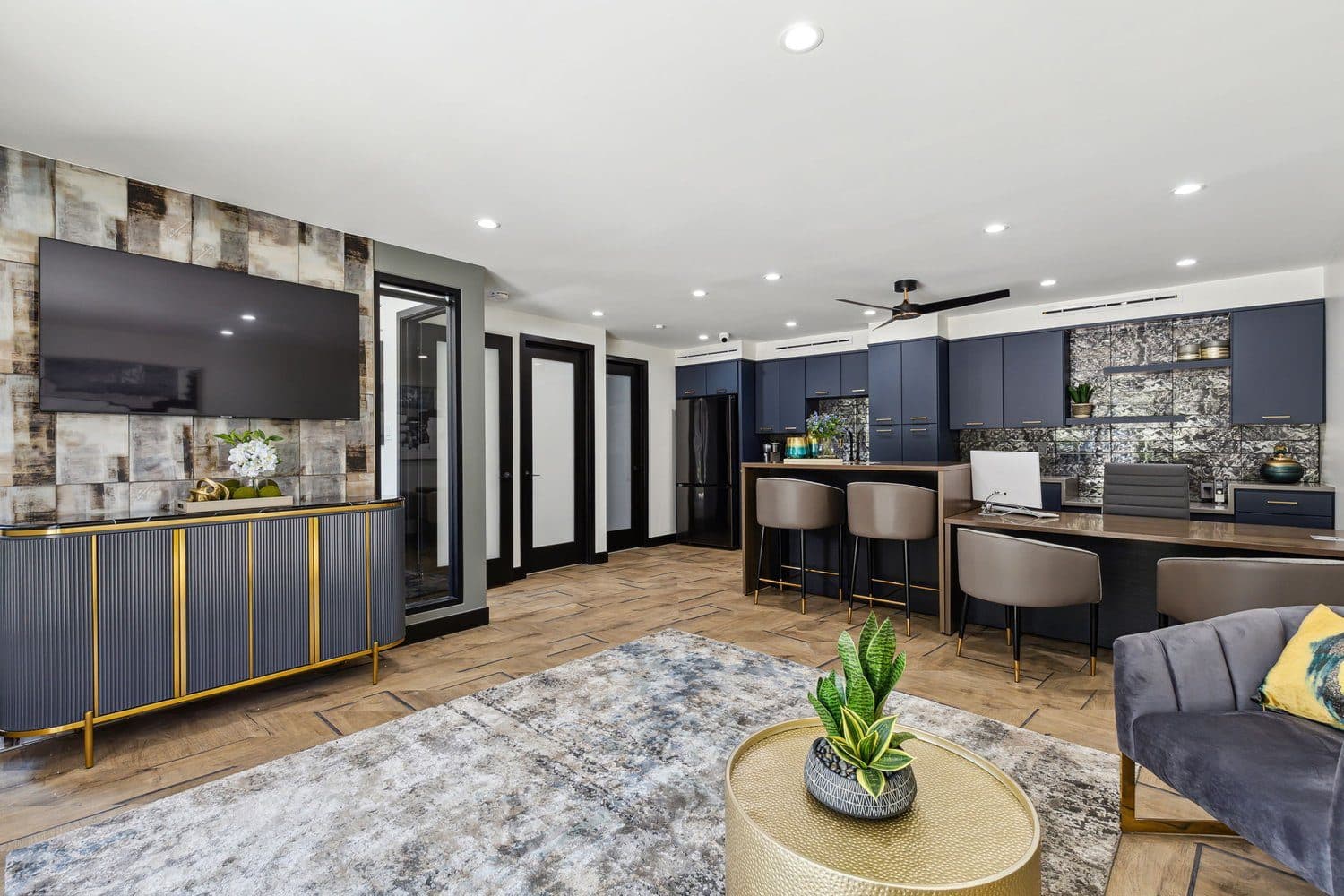 Renovated clubhouse interior with navy cabinetry and brass accents